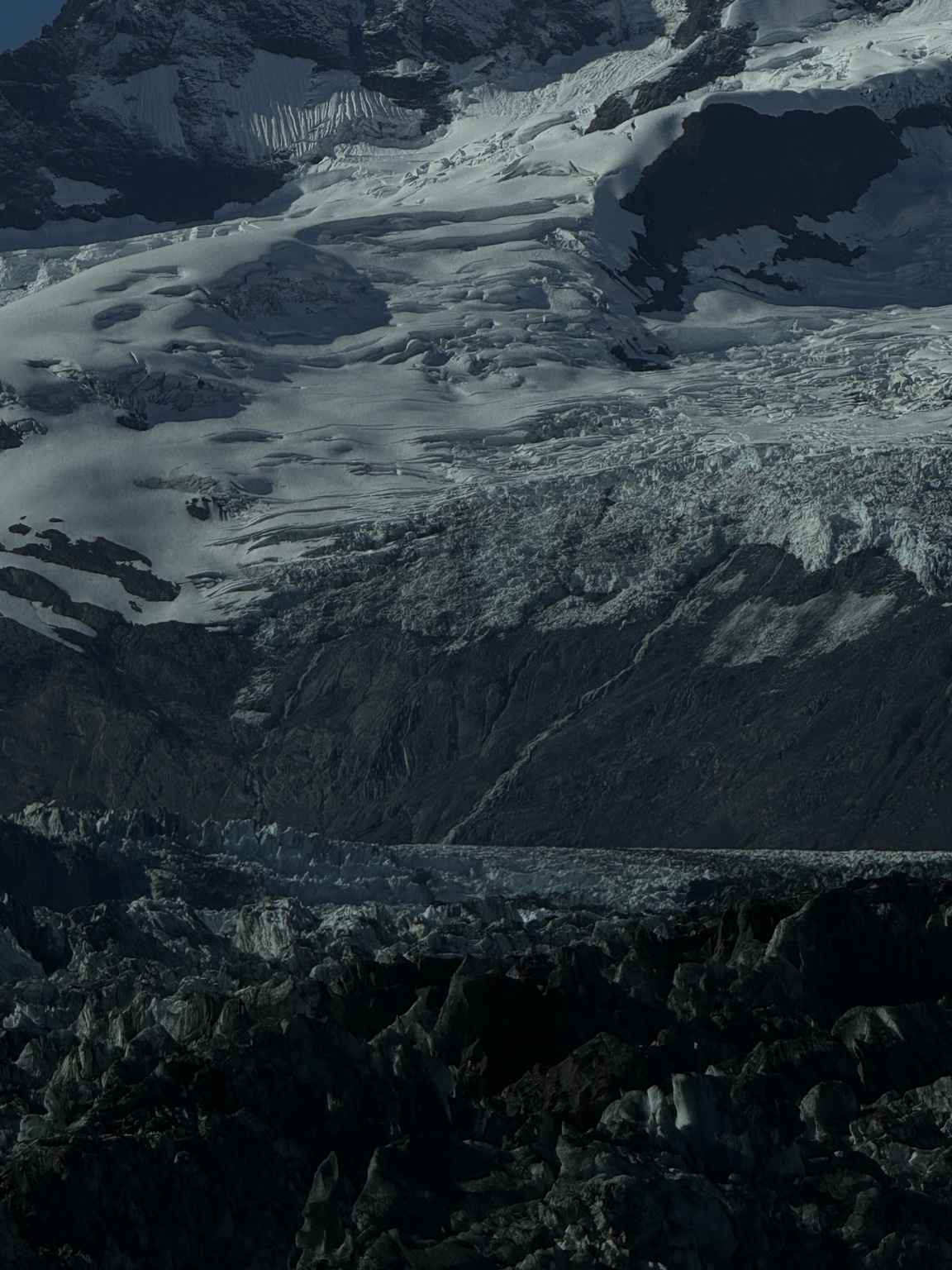 Close view of ice and snow across a mountainside